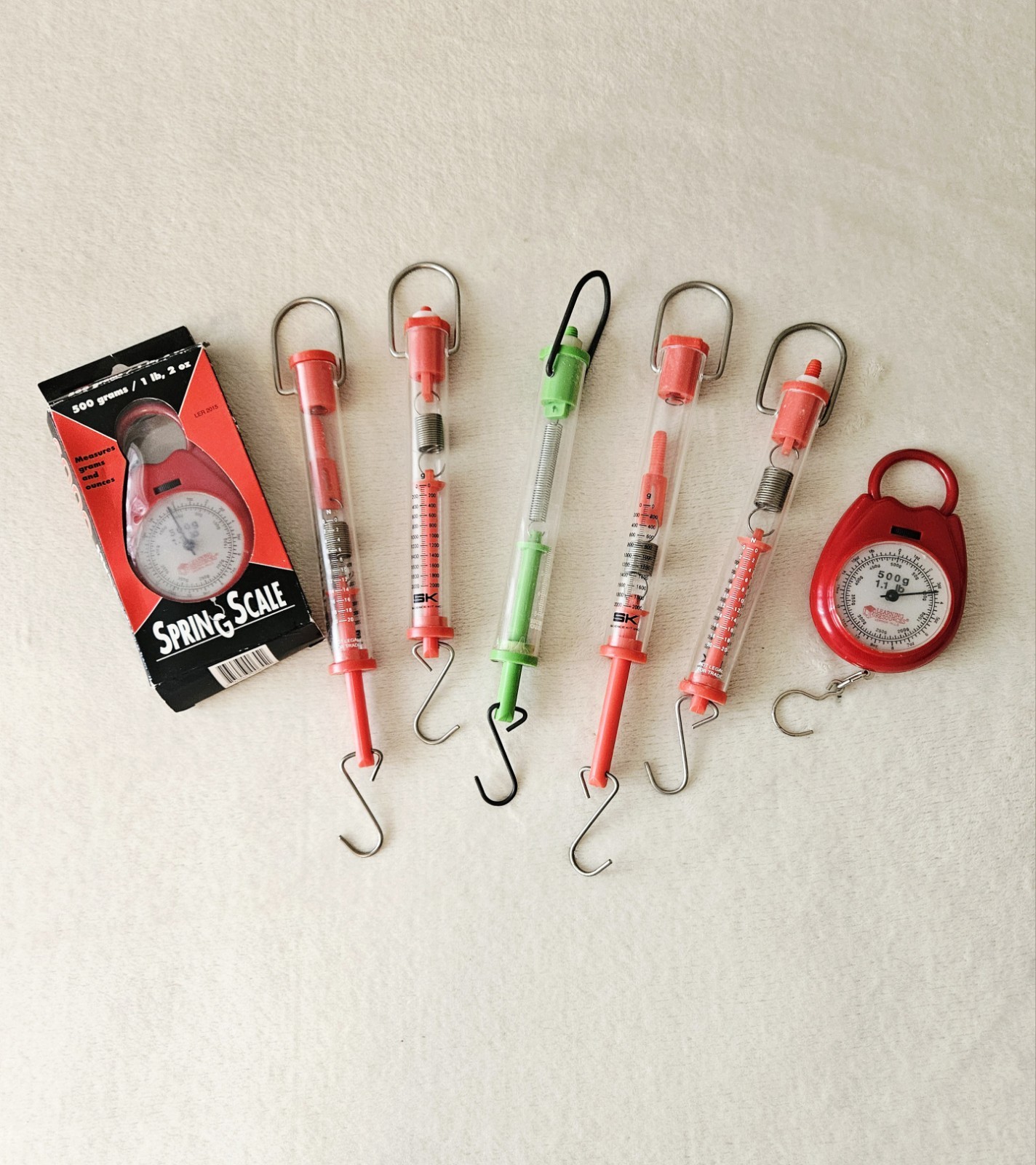Lot of 7 Hanging Spring Scales: 5 Tube Scales & 2 Round Scales